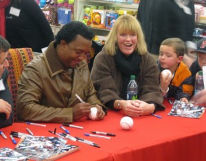 Pedro Martinez signings autographs at a toy drive